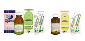 Die Produkte Camphoderm und Tussidermil stehen nebeneinander. Es sind die früheren, ursprünglichen Produkte abgebildet, bevor das Design erneuert und modernisiert wurde. Die Produkte sind hier in verschiedenen Ausführungen abgebildet (in der Tube, aber auch in der Flasche).